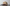 Beige cap with maroon brim and embroidered text on a gray surface