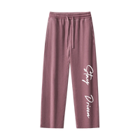 Mauve sweatpants with 'Stay Driven' text on a white background