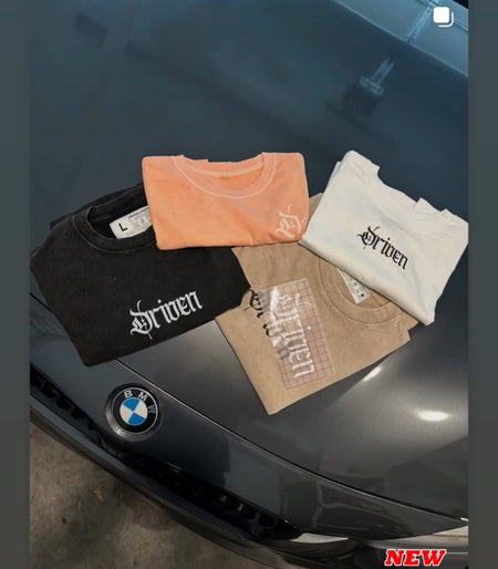 Three hoodies with branding on a car hood, featuring a visible brand collaboration announcement.