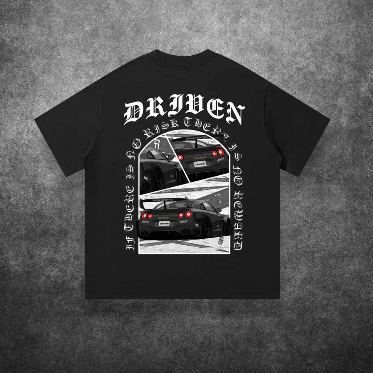 Black t-shirt with car graphic and 'Driven' text on a textured gray background