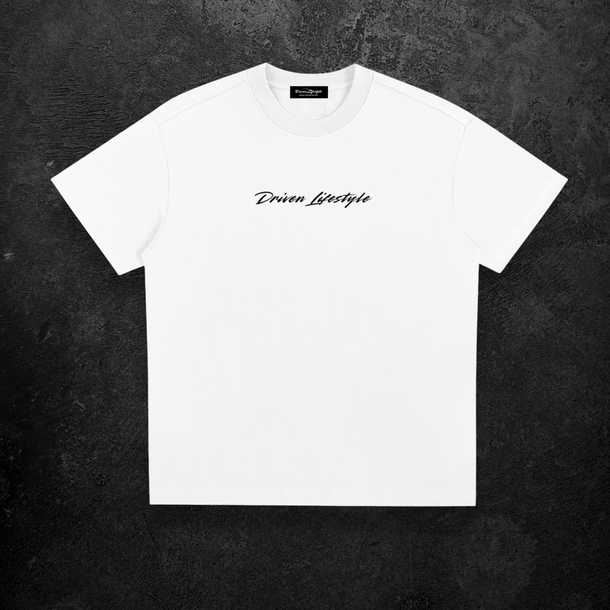 White t-shirt with 'Driven Lifestyle' text on a dark textured background